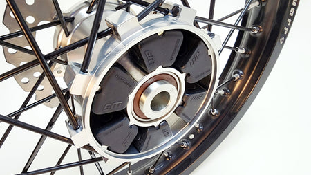 Warp 9 cush drive rear hub with black rubber cush blocks fitted, laced into a wheel