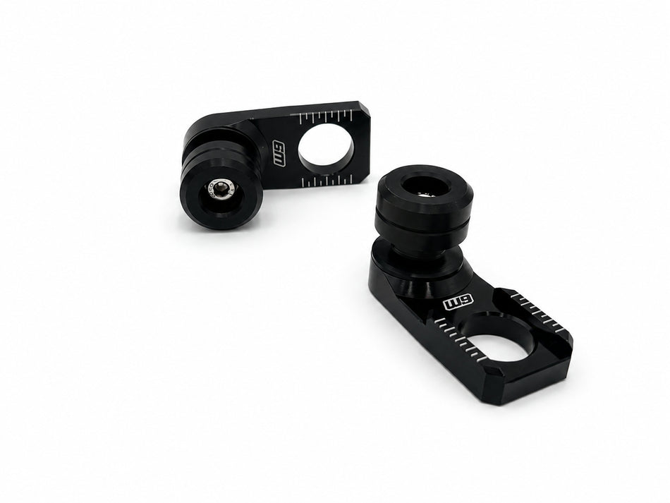 Warp 9 rear axle sliders: black anodized adjuster blocks with chain alignment marks and replaceable black spools