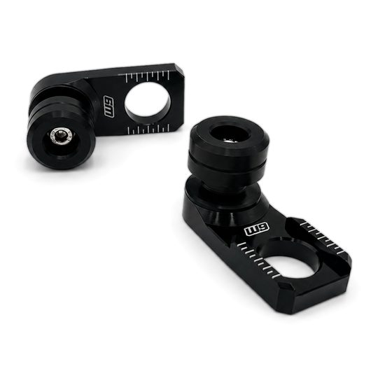 Warp 9 rear axle sliders: black anodized adjuster blocks with chain alignment marks and replaceable black spools