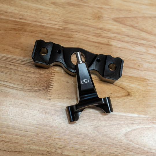 Warp 9 Ultra Bee steering stabilizer mount in black aluminum with its frame post