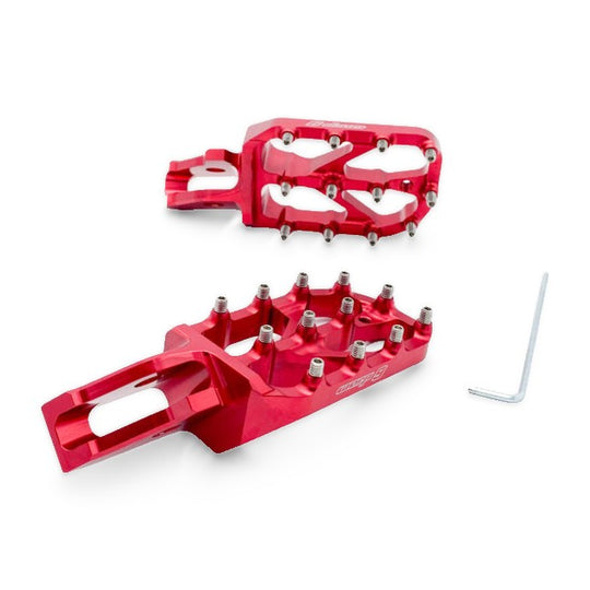 Pair of Warp 9 Elite foot pegs in red anodized aluminum with stainless teeth and an Allen key