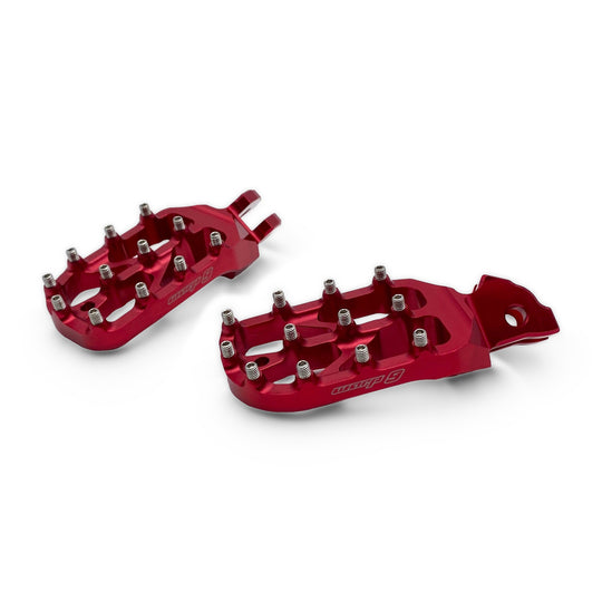 Pair of Warp 9 Elite foot pegs in red anodized aluminum with stainless steel teeth