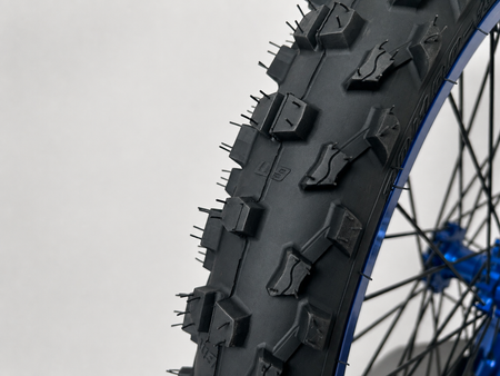 Warp 9 MXE-9 70/100-19 front tire, close-up of the knobs
