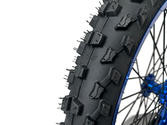 Warp 9 MXE-9 70/100-19 front tire, close-up of the knobs
