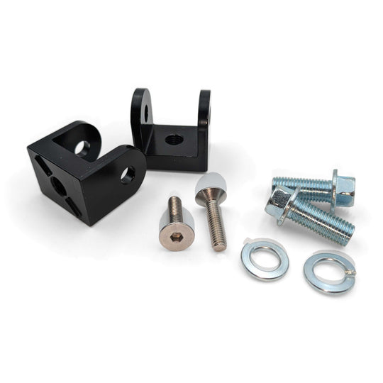 Warp 9 foot peg mount parts kit for the Surron Light Bee, 79Bike and Ultra Bee: two black peg brackets with bolts
