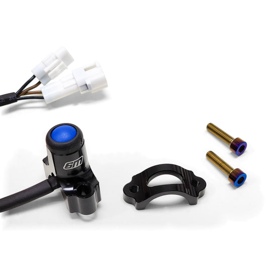 Warp 9 Surron Light Button V2: blue push button in a black housing with plug-in harness, back half clamp and two burnt titanium screws