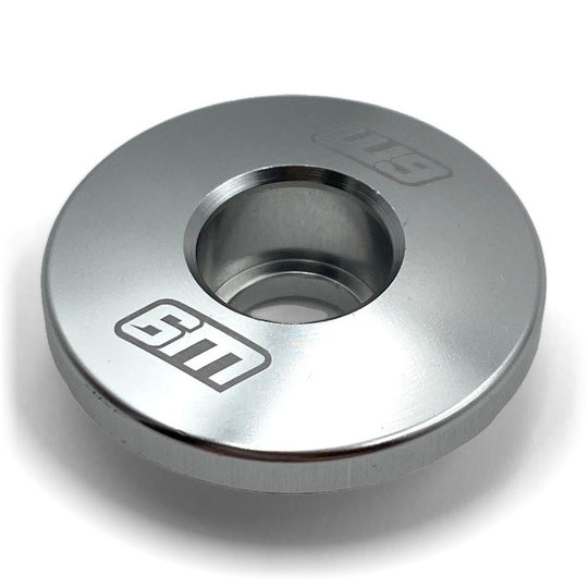 Warp 9 steer lock replacement cap in silver anodized aluminum with the W9 logo