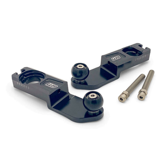 Warp 9 Ultra Bee trailer mounts, a pair of black aluminum axle blocks with ball hitches and two stainless bolts