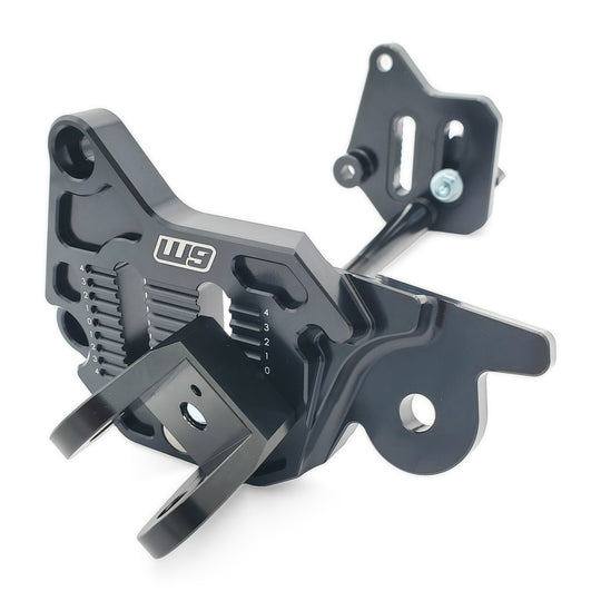 Warp 9 Ultra Bee adjustable foot peg mount, black machined brackets with numbered height and rearward adjustment marks
