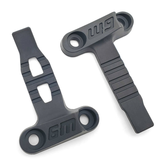 Pair of Warp 9 Ultra Bee low profile steer stops in molded gray rubber with W9 logos