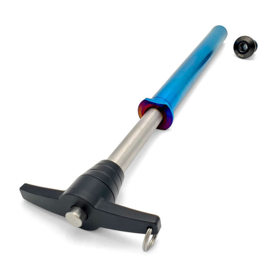 Warp 9 Stark Varg titanium rear axle in burnt blue with its T-handle puller and black titanium nut