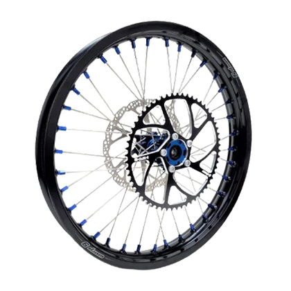 Warp 9 e-moto rear wheel with black rim, silver spokes with blue nipples, black hub with blue center, brake rotor and sprocket