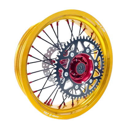 Warp 9 supermoto rear wheel with gold anodized 17-inch rim, red hub, black spokes with red nipples, black rear sprocket and brake rotor