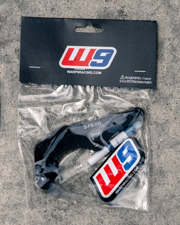 Warp 9 Surron Ultra Bee 300mm caliper adapter bracket S-FB300 in its package