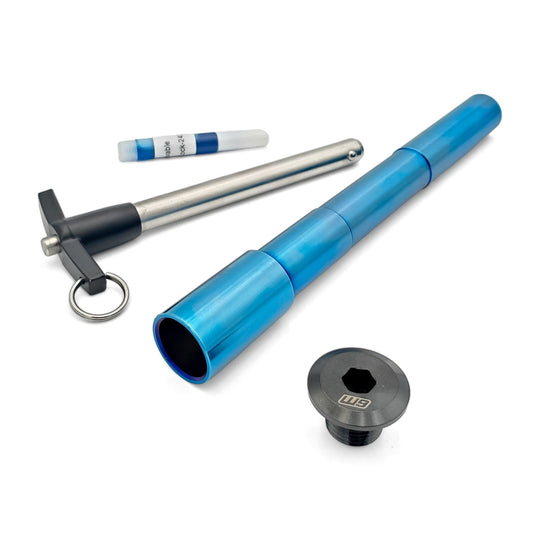 Warp 9 Ultra Bee titanium front axle in blue anodized titanium with its T-handle, axle nut and thread locker