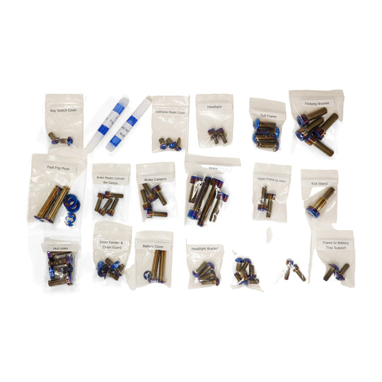 Warp 9 Light Bee titanium chassis kit: labeled bags of burnt titanium bolts sorted by location, with blue thread locker