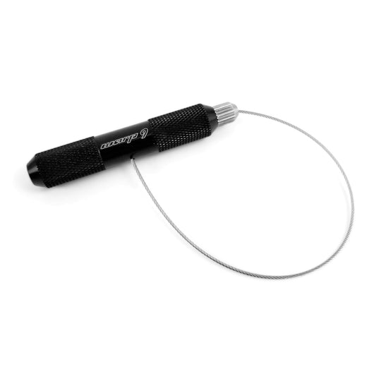 Warp 9 valve stem puller, a black knurled aluminum handle with its steel pull cable