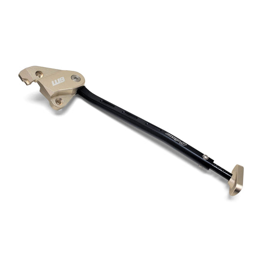 Warp 9 add-on kickstand for KTM motocross bikes: black stand with a bronze anodized frame bracket and foot