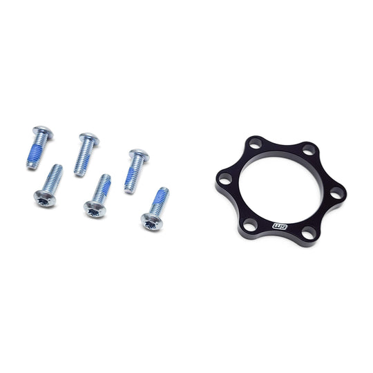 Warp 9 5mm front wheel boost spacer in black anodized aluminum with six Torx bolts
