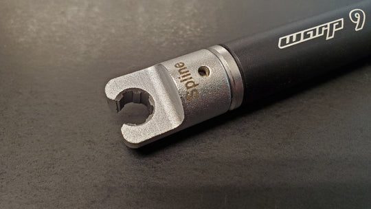Warp 9 spline spoke wrench tip in steel on a black wrench handle